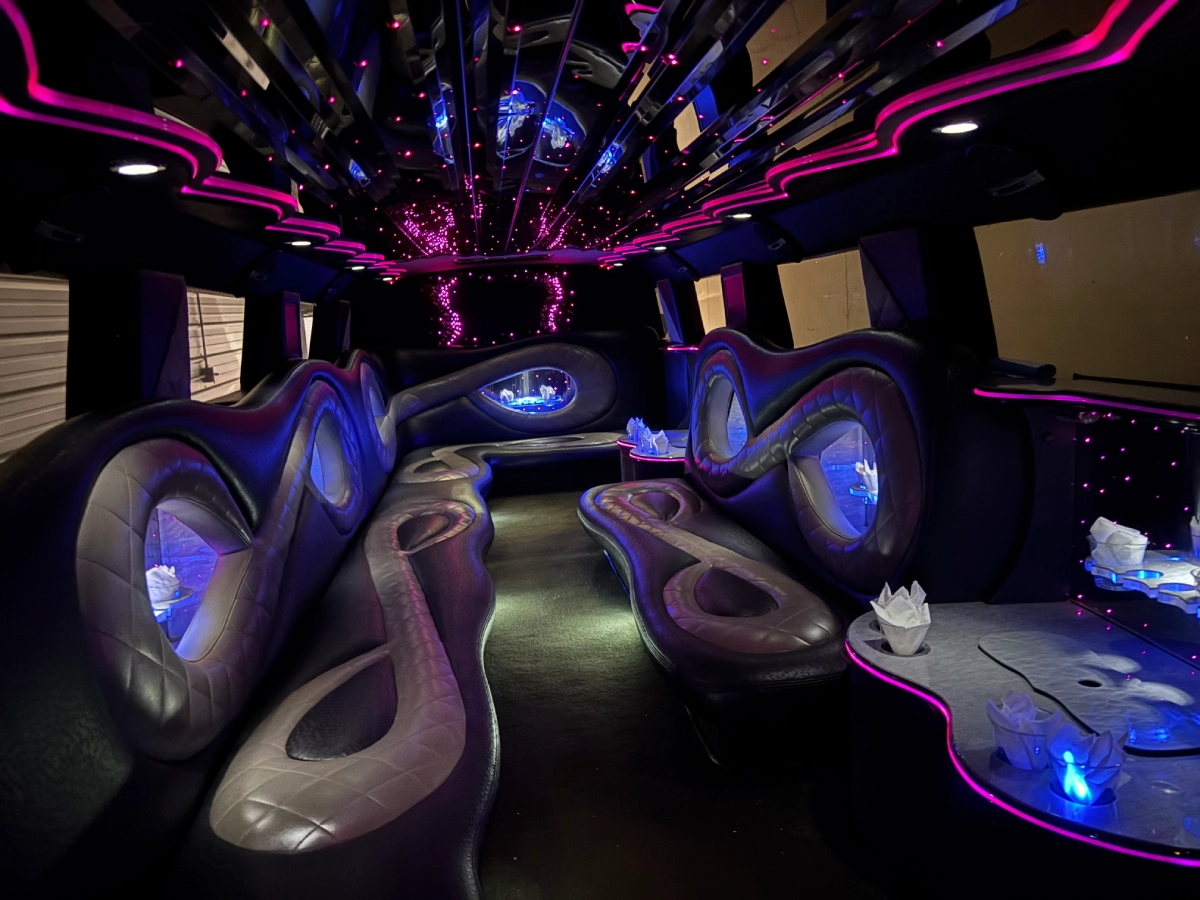 Limousine rental for prom interior featuring blue lighting and sleek seats.